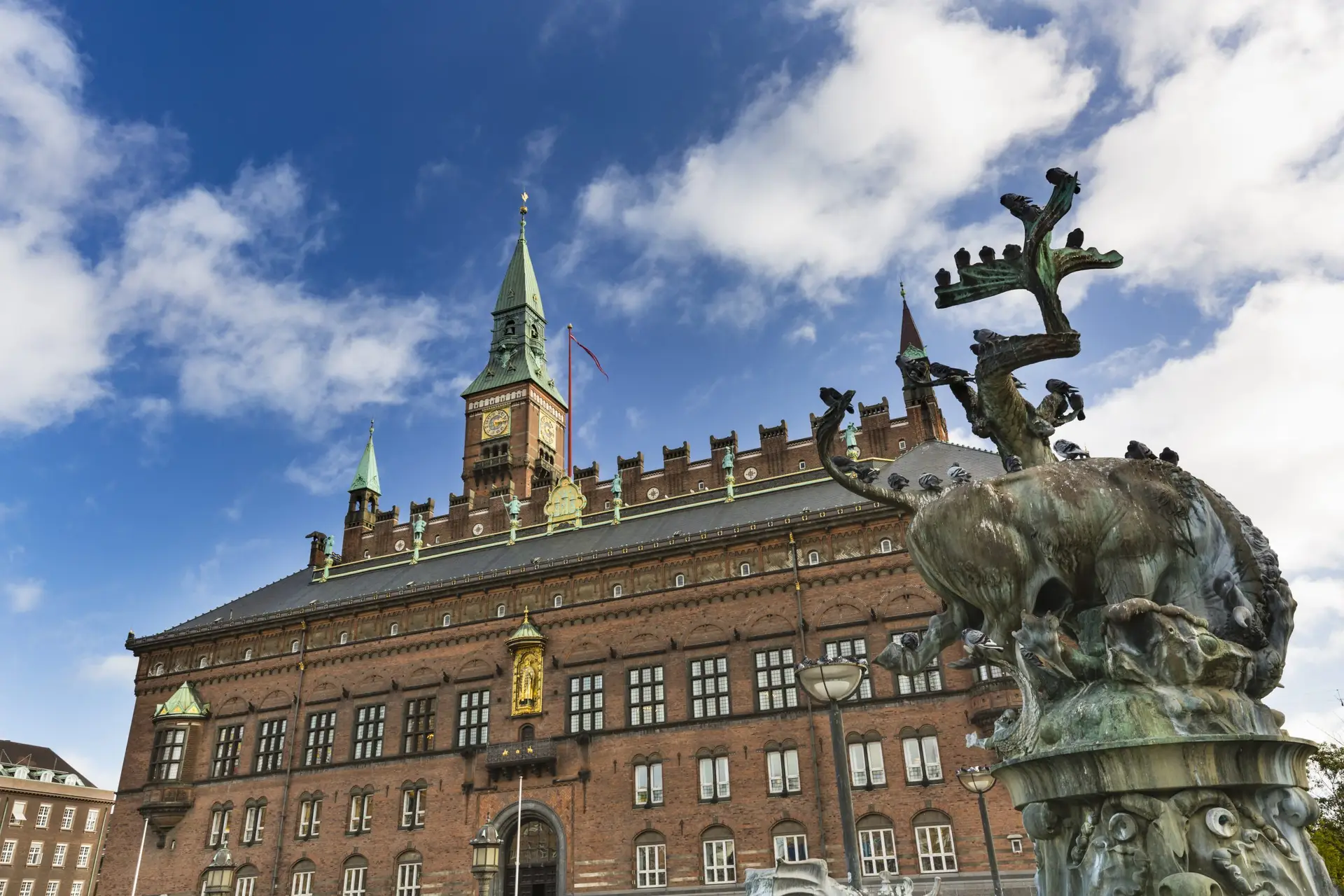 Where is Copenhagen located? Where is Copenhagen located? This striking view of Copenhagen City Hall highlights the city's historic architecture and cultural significance in Denmark.