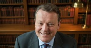 Jens Otto Krag smiling.